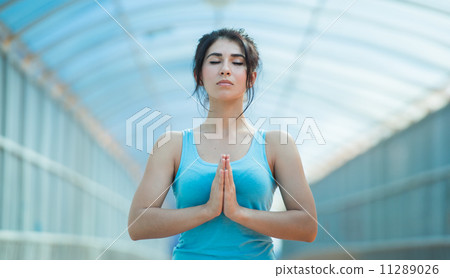 Young woman prayer position Young woman prayer position 11289026