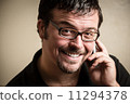 Adult man portrait, wearing glasses. 11294378