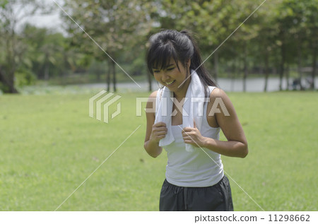 Jogging woman running in park. Sport fitness model of Asian trai 11298662