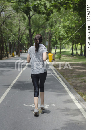 Jogging woman running in park. Sport fitness model of Asian trai 11298751