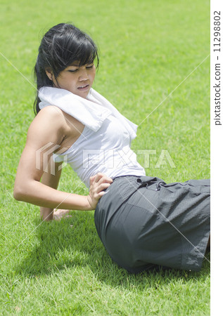 asian woman experiencing backache after exercise asian woman experiencing backache after exercise 11298802