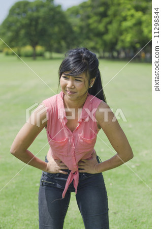 Young woman with stomach ache 11298844