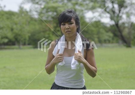 Jogging woman running in park. Sport fitness model of Asian trai 11298867