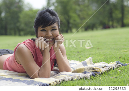 Portrait Of Asian Young Smiling Girl In Park 11298883