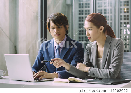 Business People Having Meeting Around Business People Having Meeting Around 11302002