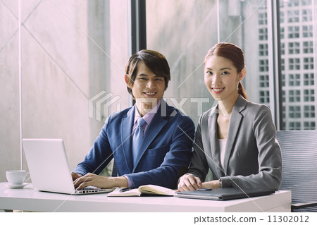 Business People Having Meeting Around Business People Having Meeting Around 11302012