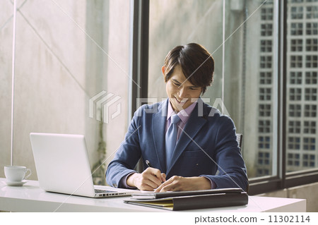Young Business Man In Modern Office 11302114