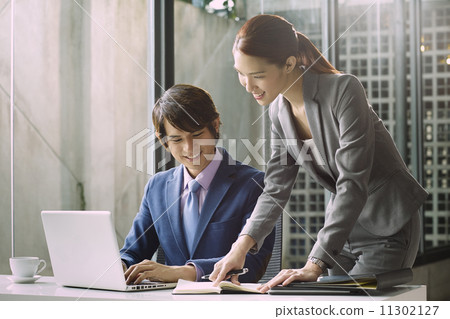 Business People Having Meeting Around 11302127