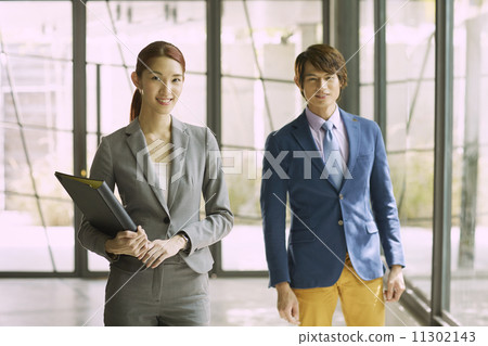 Young Business Partners in Urban Setting 11302143