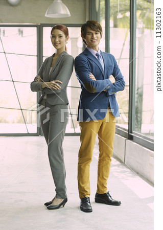 Young Business Partners in Urban Setting 11302163