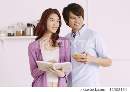 Couple Cooking Healthy Food In Kitchen Lifestyle Meal Preparation 11302164