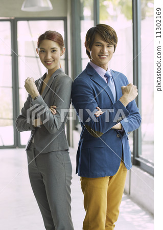 Young Business Partners in Urban Setting 11302169
