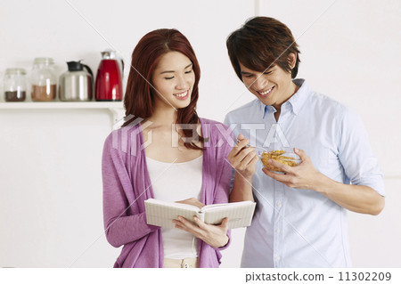 Couple Cooking Healthy Food In Kitchen Lifestyle Meal Preparation 11302209