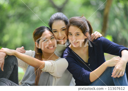 asian women relax in park, friendship 11307612