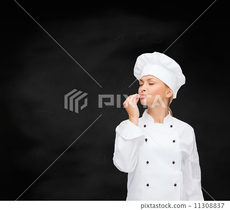smiling female chef showing delicious sign smiling female chef showing delicious sign 11308837