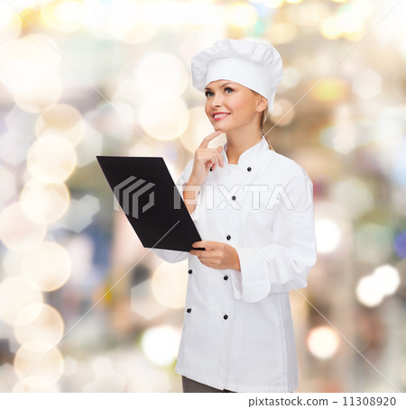 smiling female chef with black blank paper smiling female chef with black blank paper 11308920