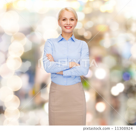 young smiling businesswoman with crossed arms young smiling businesswoman with crossed arms 11308924