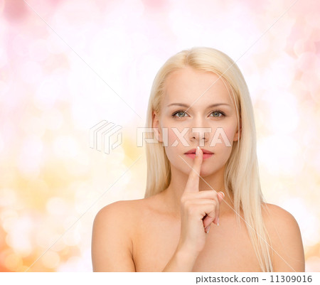 calm young woman with finger on lips calm young woman with finger on lips 11309016