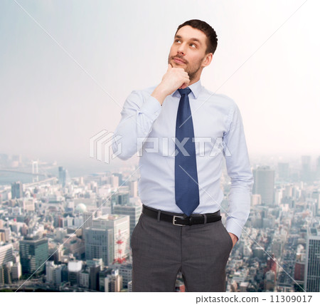 handsome businessman looking up handsome businessman looking up 11309017