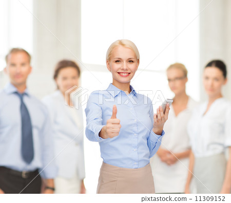 young smiling businesswoman with smartphone 11309152