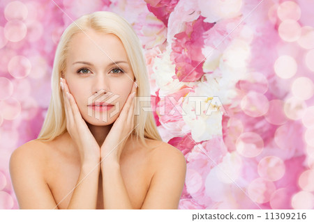 beautiful woman touching her face skin 11309216