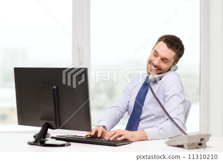 smiling businessman or student with computer 11310210