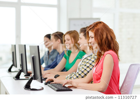 female student with classmates in computer class female student with classmates in computer class 11310727