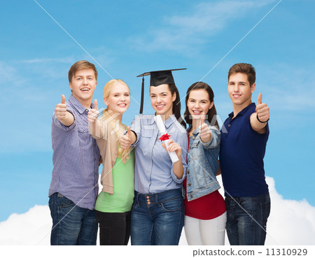 group of students with diploma showing thumbs up 11310929