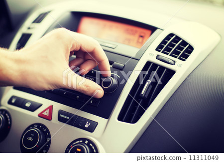 man using car audio stereo system 11311049