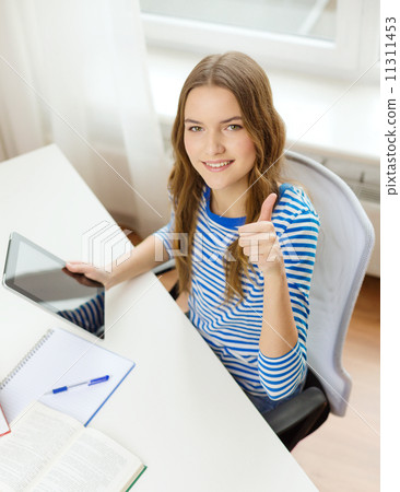 smiling student girl with tablet pc and books smiling student girl with tablet pc and books 11311453