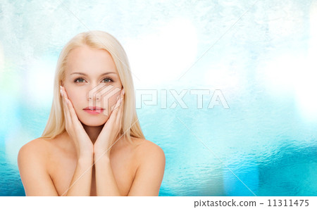 face of beautiful woman touching her face skin face of beautiful woman touching her face skin 11311475