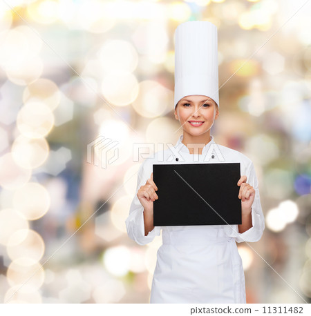 smiling female chef with black blank paper 11311482