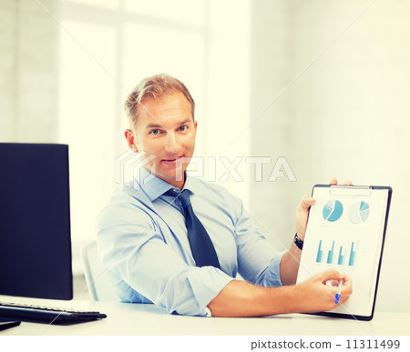 businessman showing graphs and charts businessman showing graphs and charts 11311499