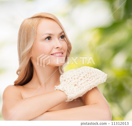 smiling woman with exfoliation glove smiling woman with exfoliation glove 11312013
