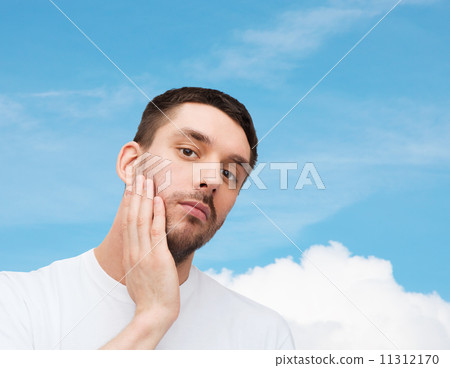 beautiful calm man touching his face beautiful calm man touching his face 11312170