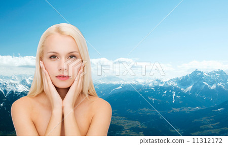 face of beautiful woman touching her face skin face of beautiful woman touching her face skin 11312172