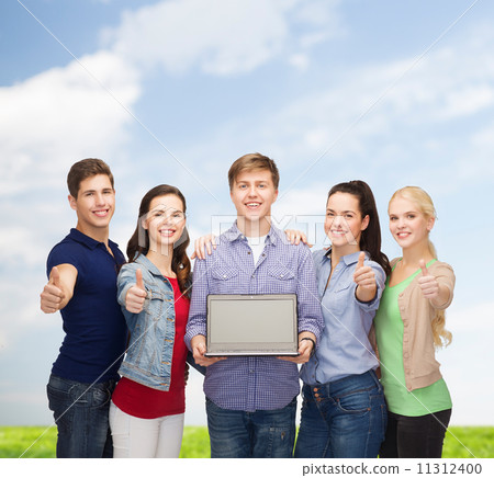 smiling students with laptop computer smiling students with laptop computer 11312400