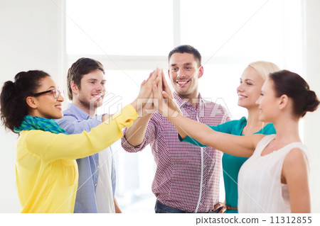 creative team doing high five gesture in office creative team doing high five gesture in office 11312855