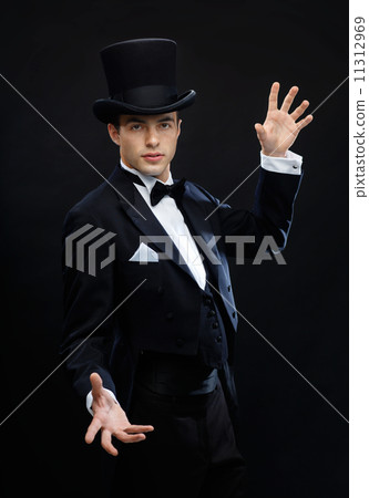 magician in top hat showing trick magician in top hat showing trick 11312969