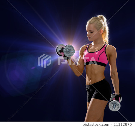 sporty woman with heavy steel dumbbells sporty woman with heavy steel dumbbells 11312970