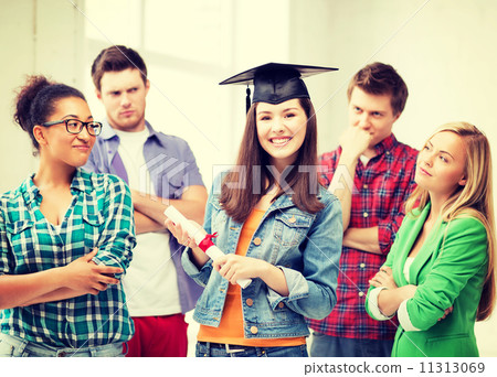 girl in graduation cap with certificate 11313069