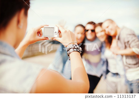 close up of female hands holding digital camera 11313137