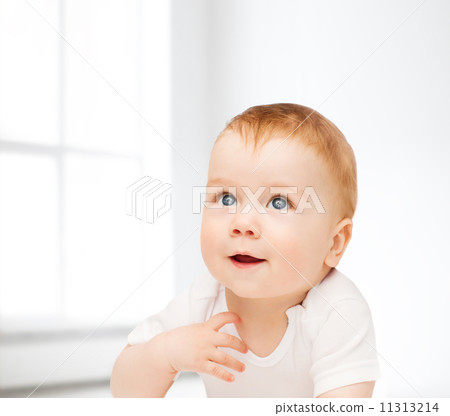 smiling baby lying on floor and looking up smiling baby lying on floor and looking up 11313214