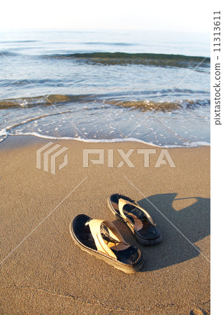 Flip flops on beach 11313611