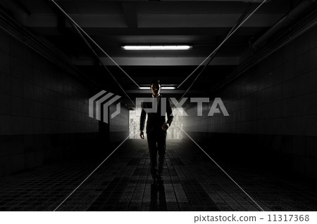Confident businessman walking toward you 11317368