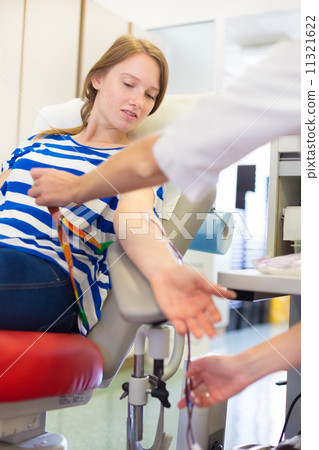 Nurse and blood donor at donation. Nurse and blood donor at donation. 11321622