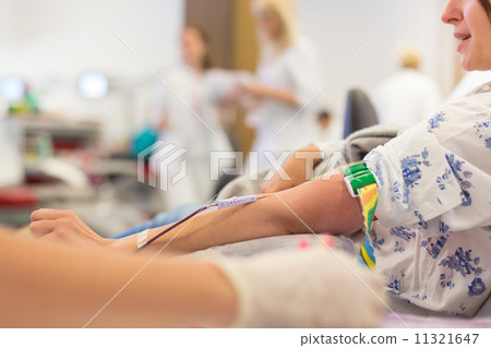 Nurse and blood donor at donation. 11321647