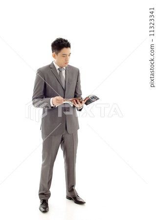 Businessman with Magazine 11323341