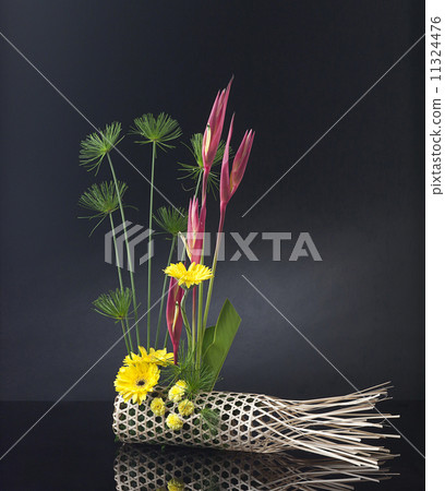 Bamboo basket decorated with bouquet of flowers Bamboo basket decorated with bouquet of flowers 11324476