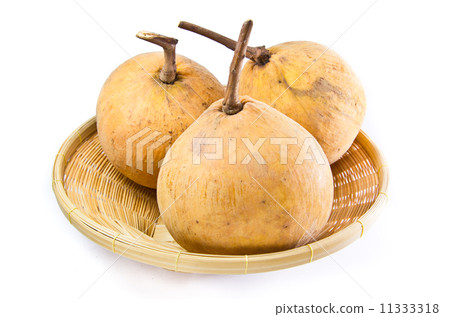Santols in wooden basket isolated on white background 11333318